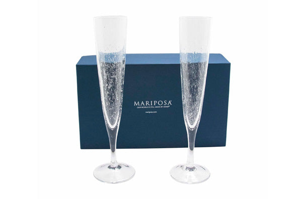 two champagne flutes with dark blue gift box